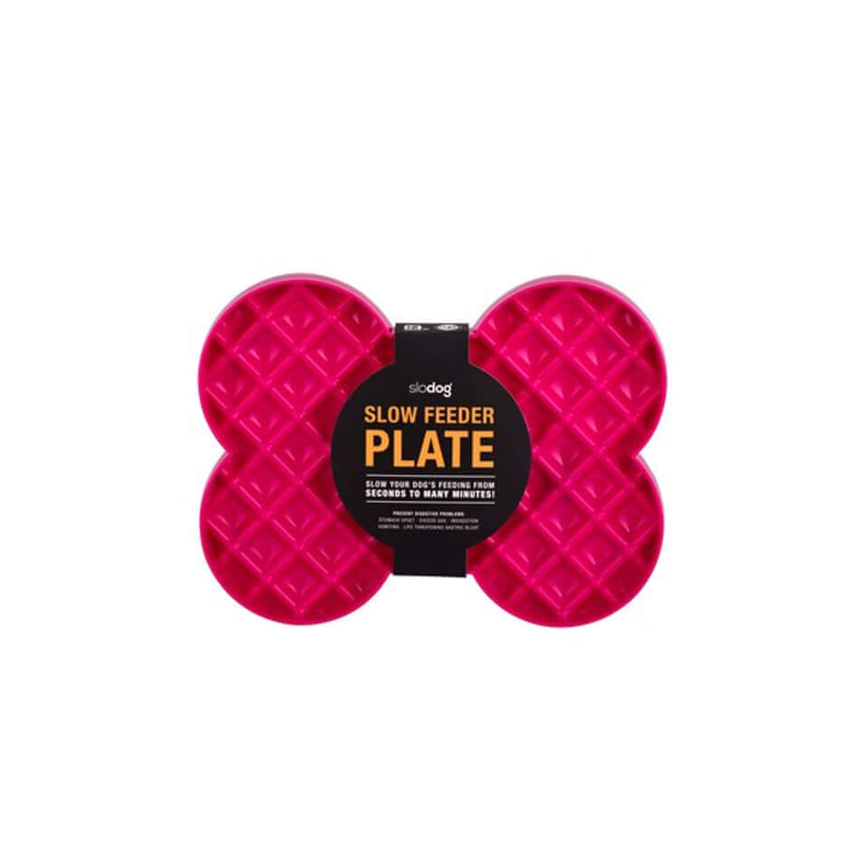 A pink slow feeder dog plate
